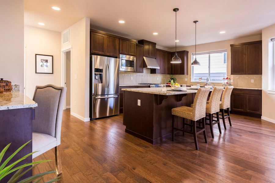 A dark wood kitchen with an island