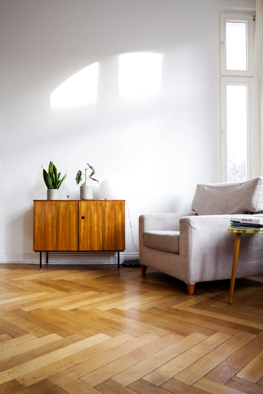Herringbone wood-look floor in a bright room